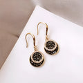 Black alloy geometric drop earrings with circular retro Hong Kong design, 3.6cm length