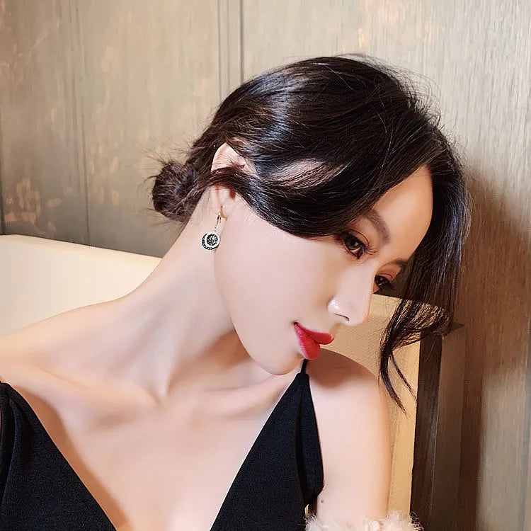 Black alloy geometric drop earrings with circular retro Hong Kong design, 3.6cm length