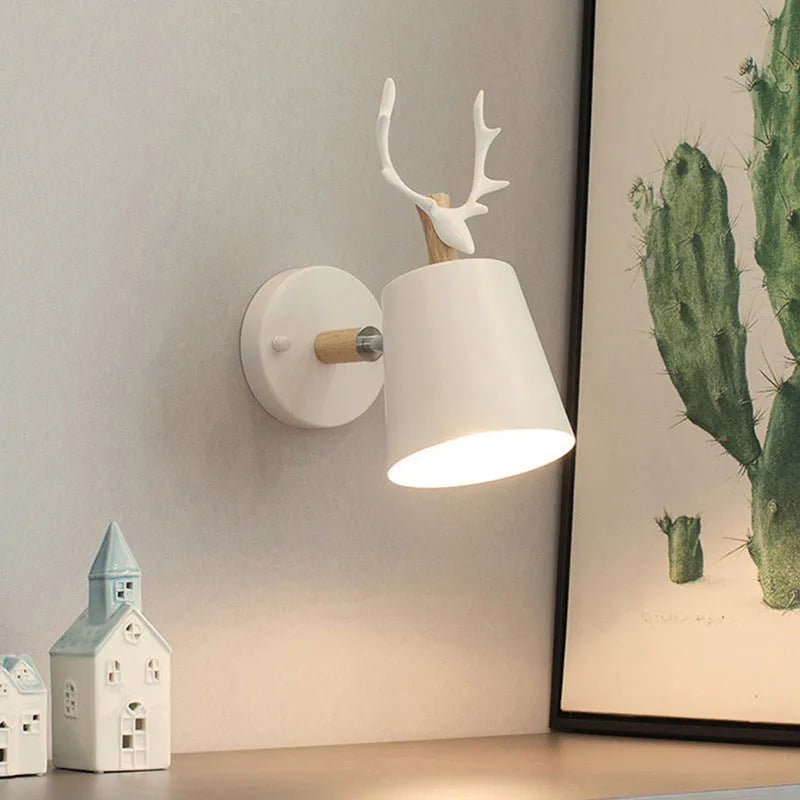 Modern antler wall lamp in black finish with iron and wood construction, measuring 24x29cm