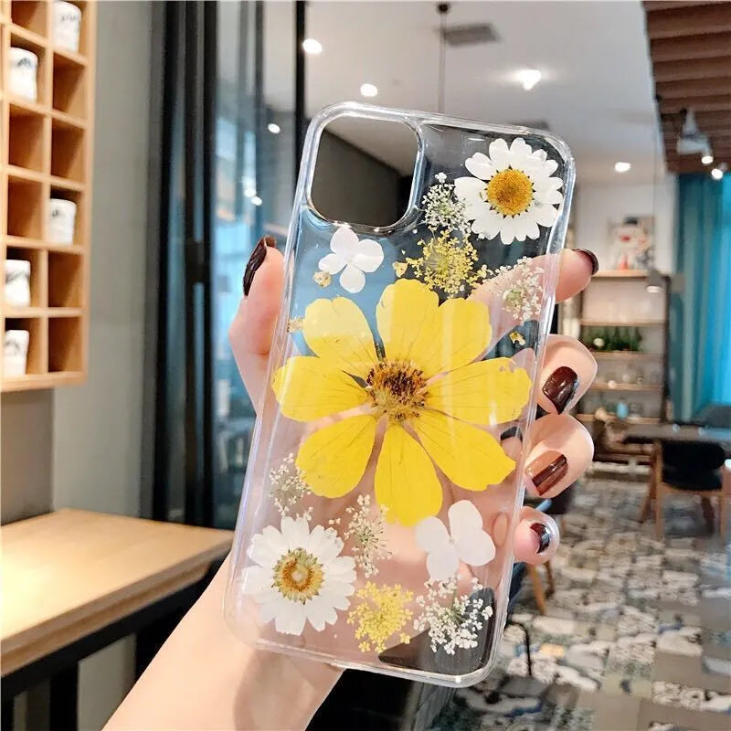 Floral TPU iPhone case with large pink and yellow flower patterns on back cover.