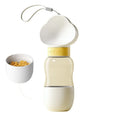 Portable dog water bottle with 2-in-1 water dispenser and food container, rotary switch, and attached belt, in purple colour.
