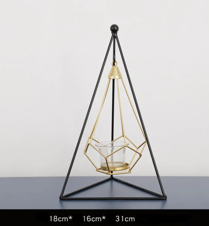 Set of six Nordic iron candle holders in various styles for block candles on a wooden shelf