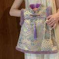 Girls' velvet padded cheongsam dress with floral pattern in purple colour on display