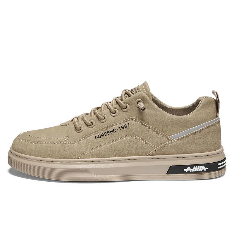 Men's khaki casual work shoe with round toe, low top, and rubber sole on a plain background.