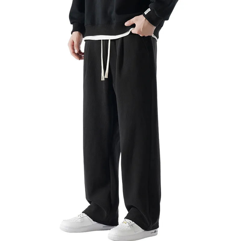Men's apricot fleece-lined winter sports pants with drawstring waist and loose Korean-style fit