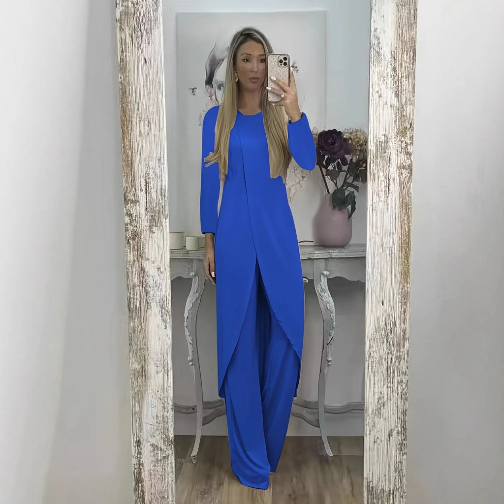 A loose-fitting black two-piece lounge set consisting of a long-sleeve round-neck top and matching trousers.