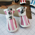 Blue cloth dog sneakers with side zipper closure, part of a set of four non-slip pet shoes