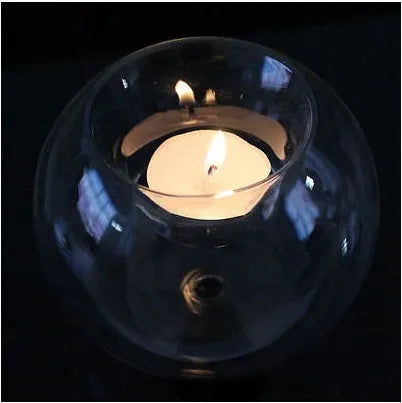 Clear round hollow handmade glass candle holder in European style on a table