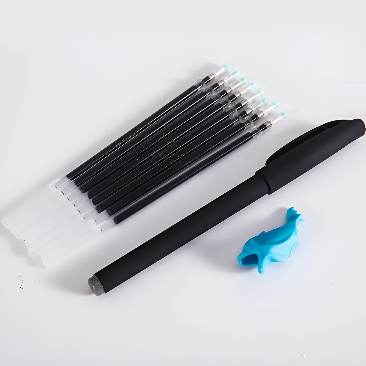 Automatic fade and disappear pen set showing pen holder and eight refill cartridges