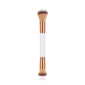 White double head makeup brush with wooden handle and nylon wool bristles on flat surface