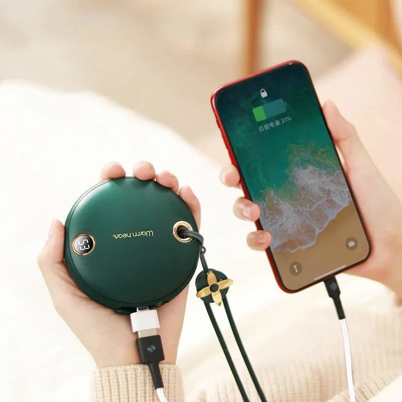 Green portable power bank with digital display, functioning as a hand warmer, shown next to its USB Type-C cable.
