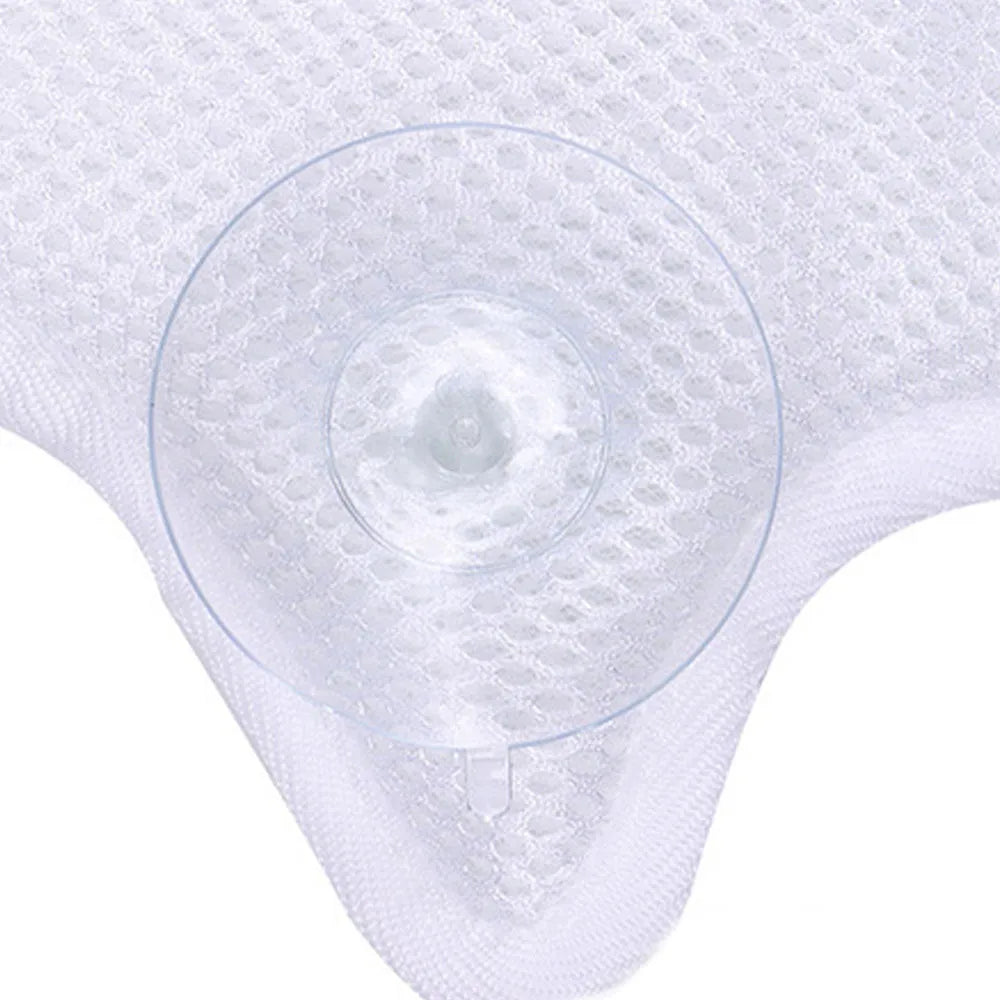 White ergonomic bathtub pillow with owl shape, 5D mesh fabric, and strong suction cups on a smooth bath surface