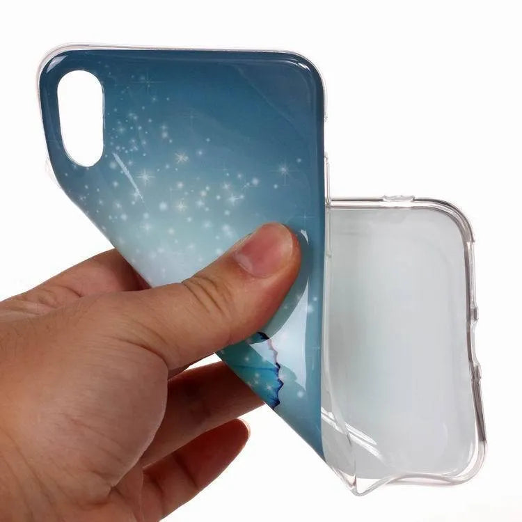 Glow in the dark iPhone case with a butterfly cartoon design on the back, showing luminous effect
