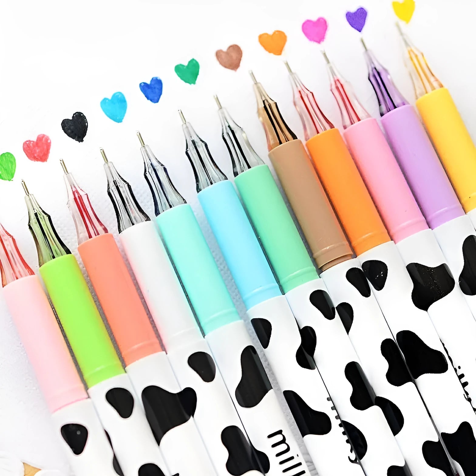Cow pattern gel pen set showing 12 coloured pens with 0.38mm fine tips