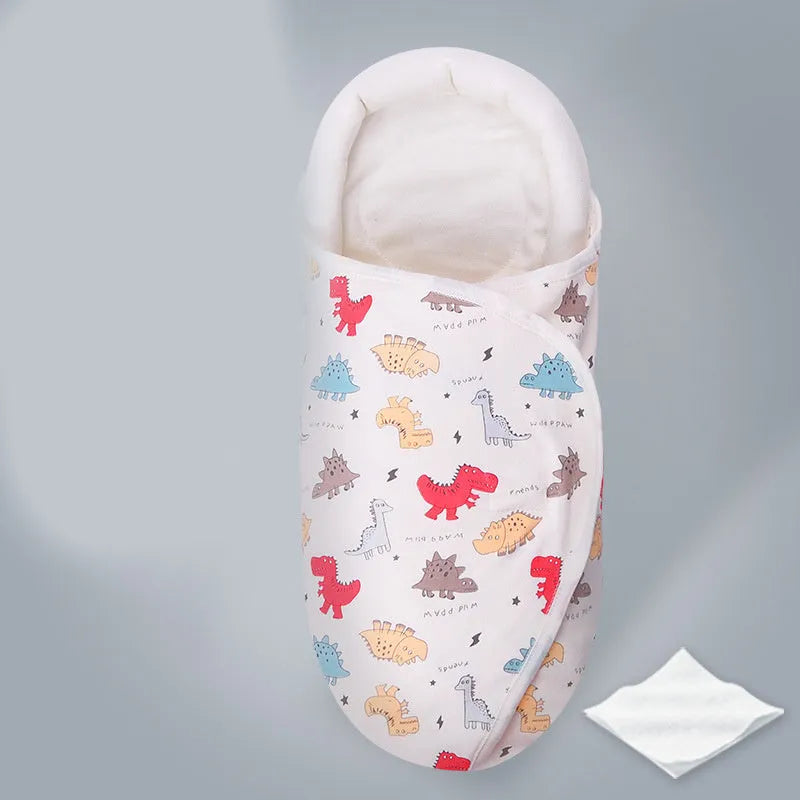 Cotton anti-startle swaddle blanket for babies in a colourful dinosaur print, 30 by 60 cm.