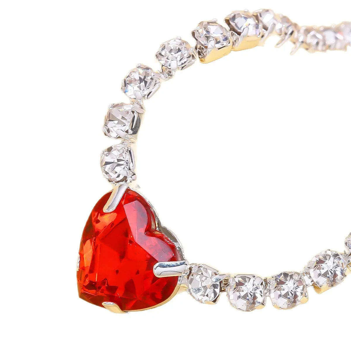 Heart pendant necklace with rhinestone crystal on a 41-50cm box chain, available in gold or silver finish.