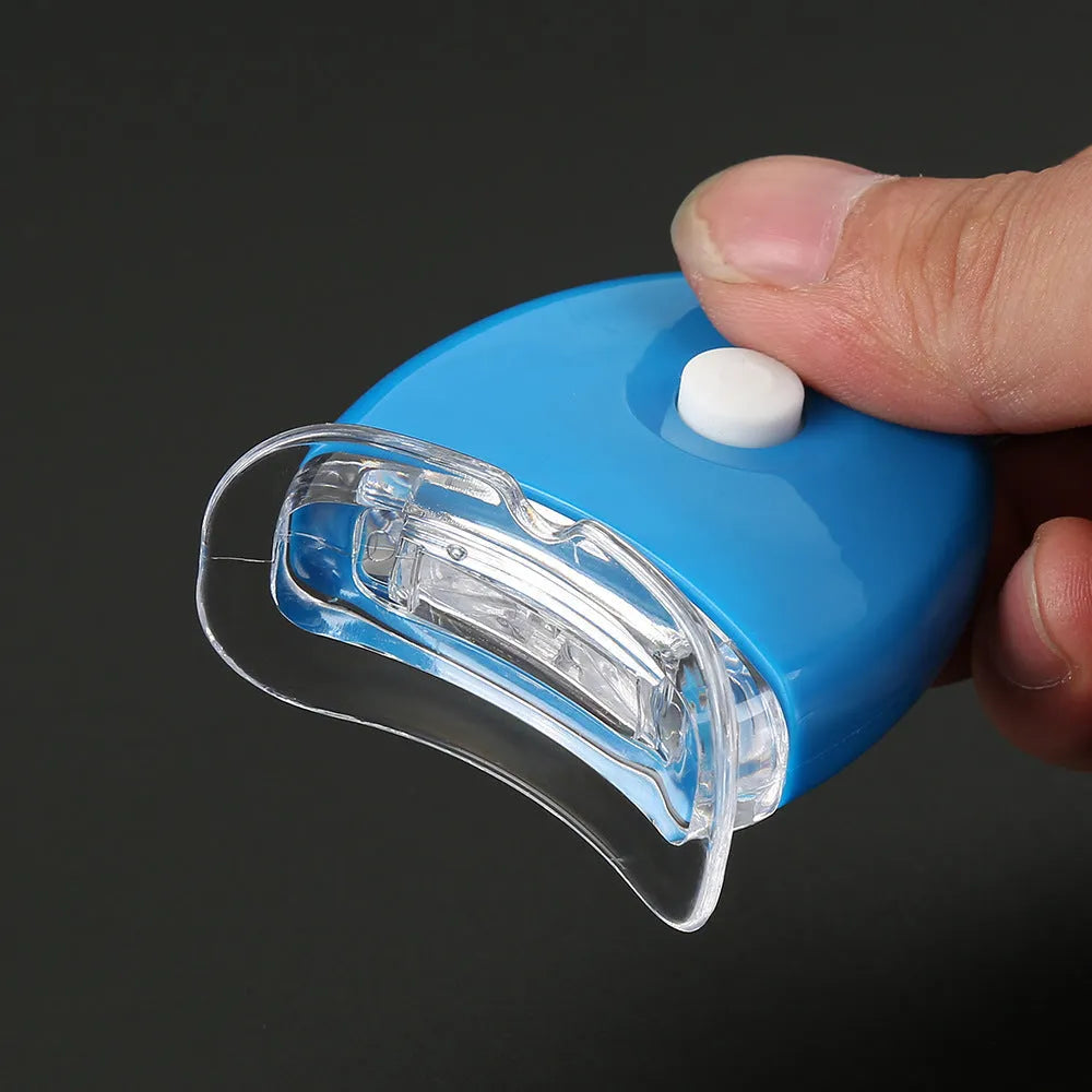 LED teeth whitening kit with button switch and denture tray in blue