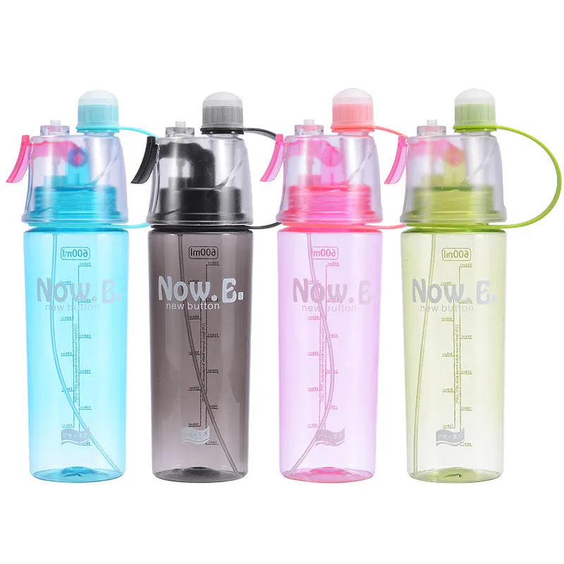 Portable mist spray sports water bottle with transparent body, handle, and press-to-spray mouth