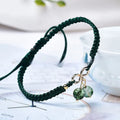 Women's natural strawberry quartz bracelet with fruit-shaped pendant and adjustable cord closure