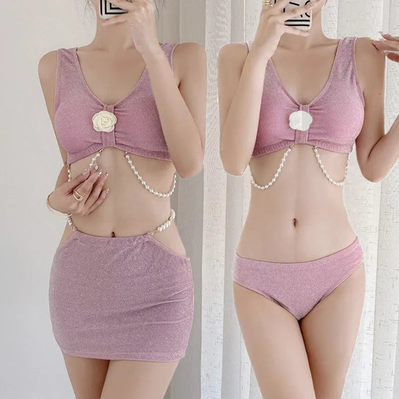 Women's pink and black three-piece polyester bikini set for swimming.
