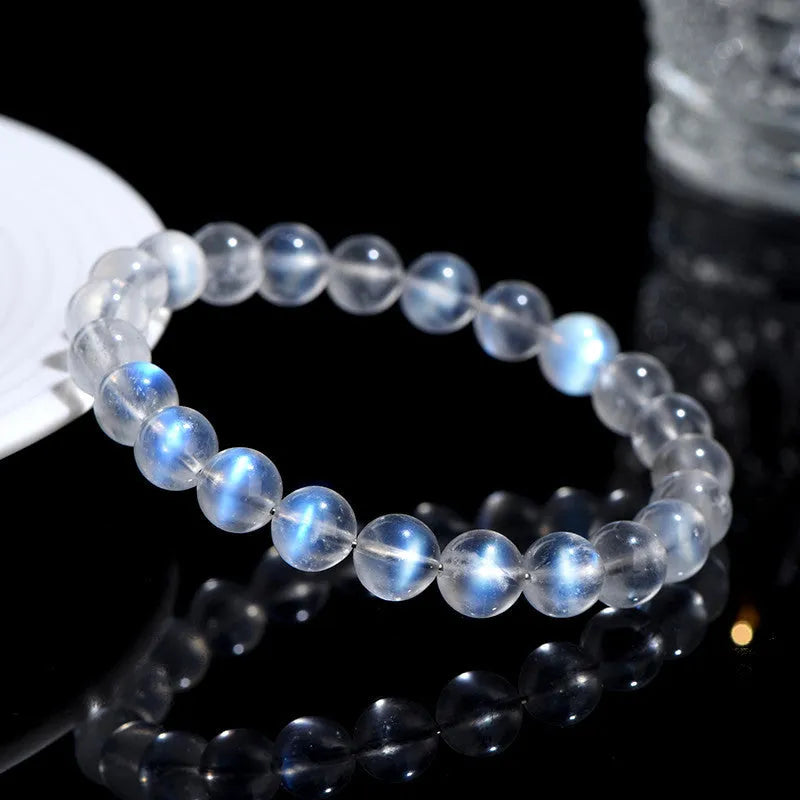 Natural cream body blue moonlight crystal bracelet showing various bead size options on a white background.