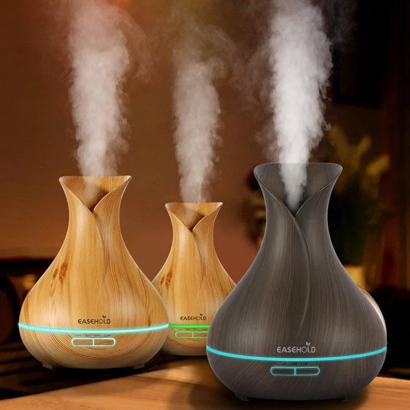 Ultrasonic aroma diffuser 400ml tank with 7 LED colour lights, dark wood finish, and plug options.