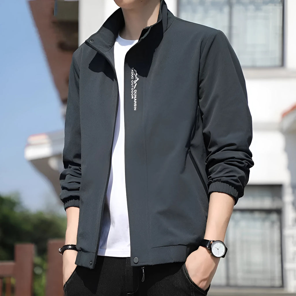 Men's black stand collar casual sports coat made from polyester fabric on a hanger.
