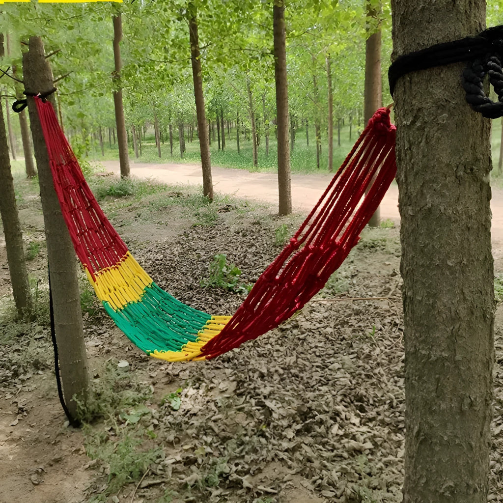 Outdoor nylon rope mesh hammock hanging between trees showing mesh construction and tying ropes
