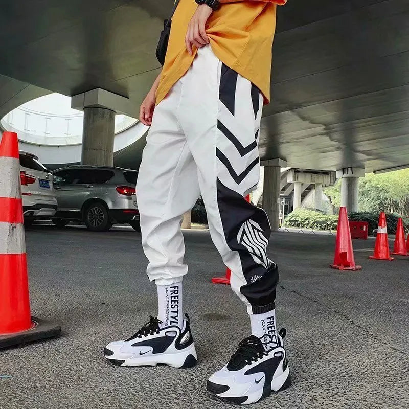 Mens hiphop tapered trousers in black acetate fibre with small-foot opening side view