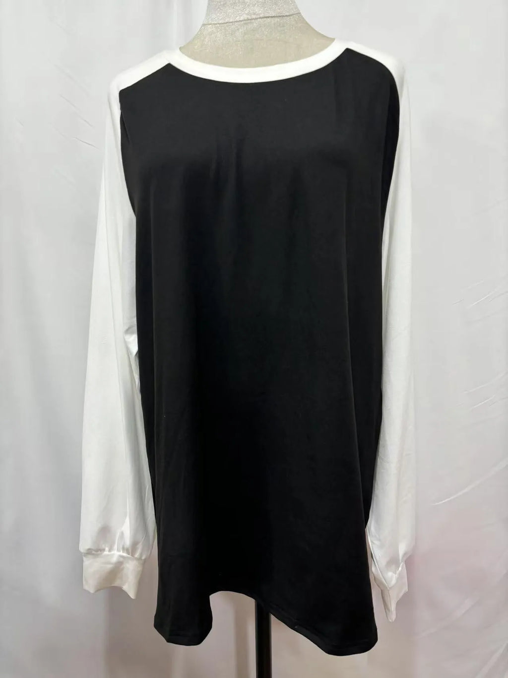Long sleeve round neck polyester T-shirt in black, blue, grey, or pink.