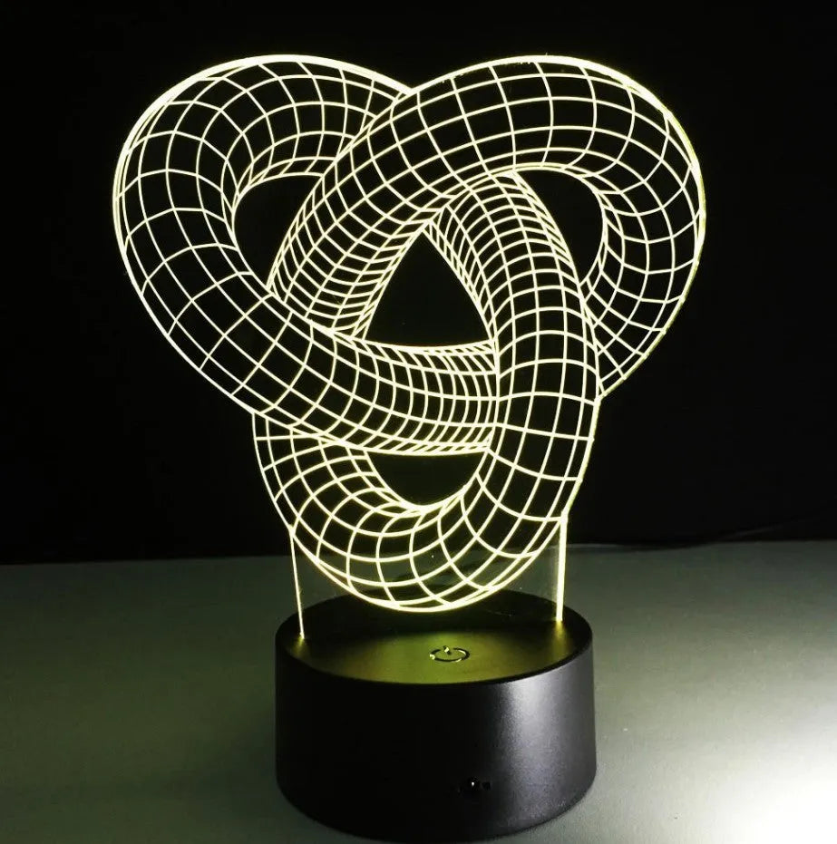 Knot 2 3D optical illusion LED lamp hologram with remote control and touch operation on a table