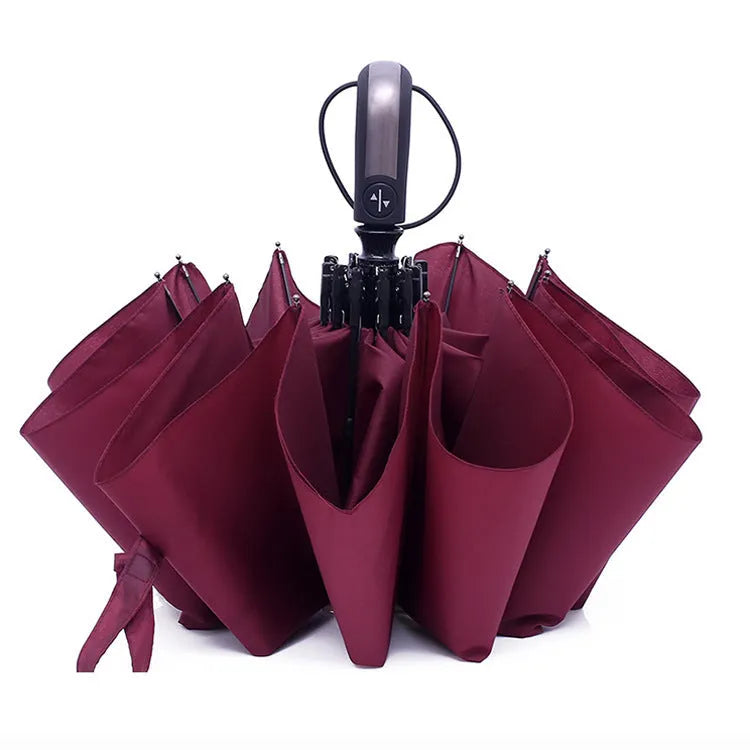 Black triple folding business umbrella with automatic opening mechanism and rubber handle