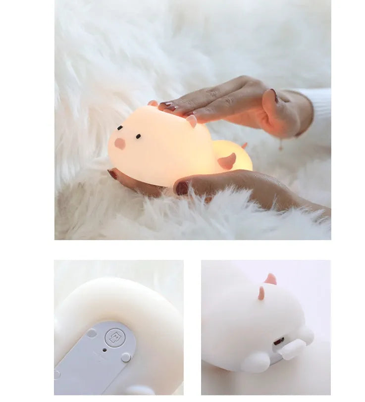 Pink silicone pig-shaped night light with touch control on bedside table