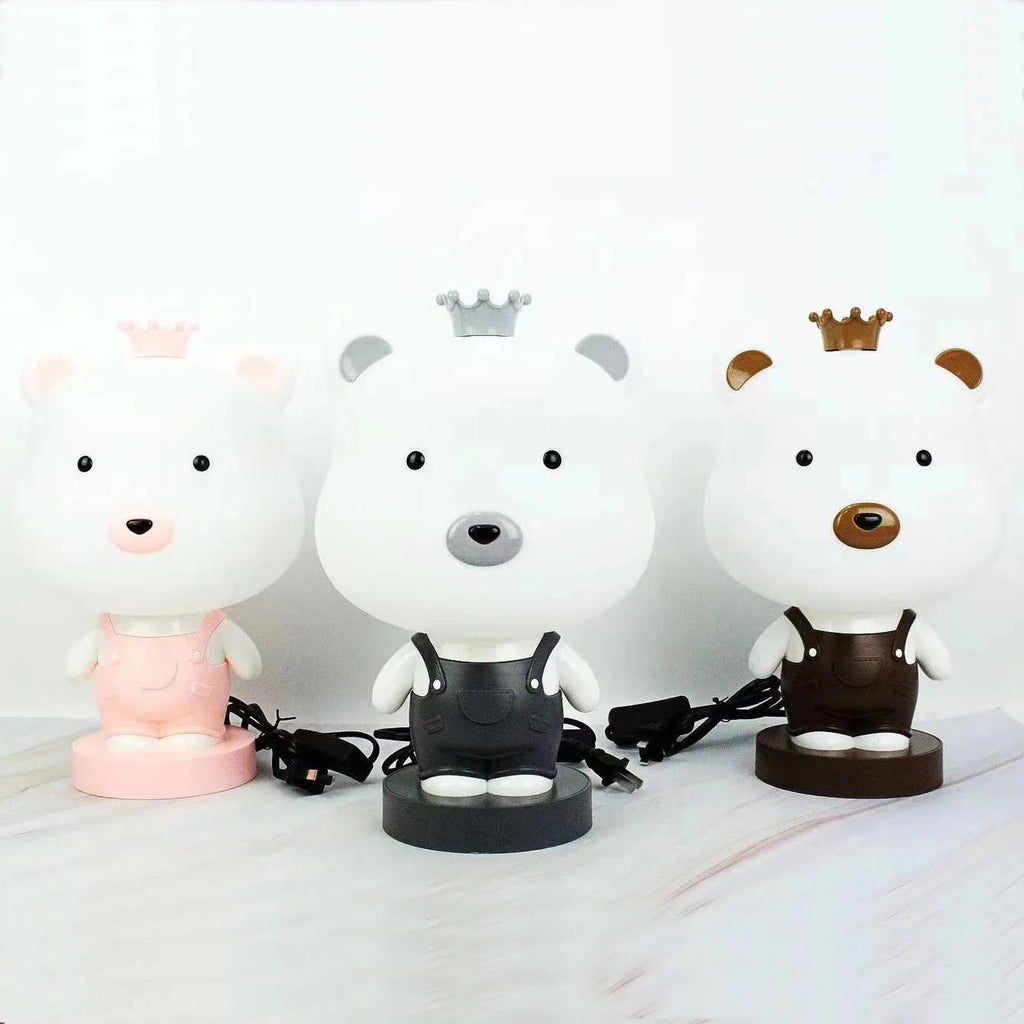 Cartoon animal table lamp in plastic, available as a bear, cow, rabbit, or tiger design.