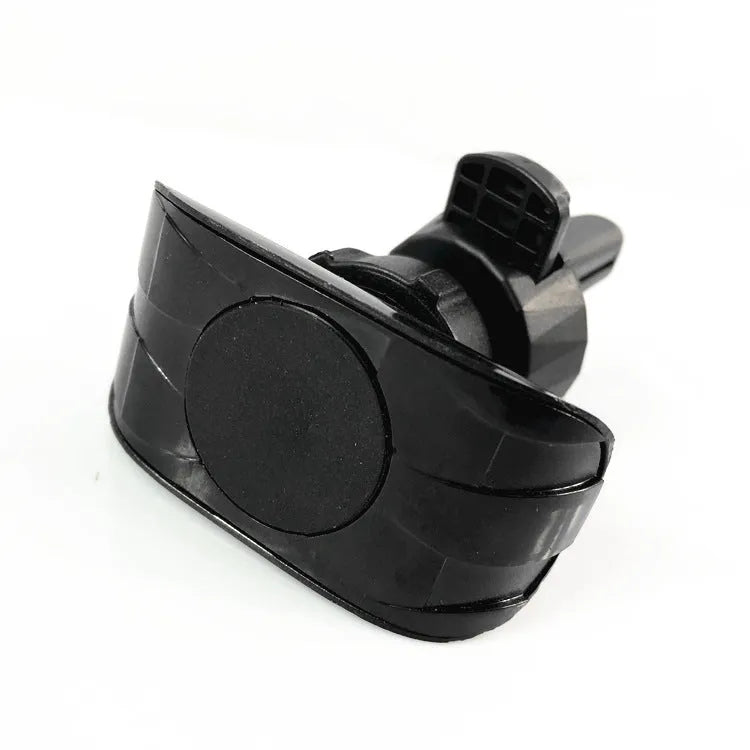 Black magnetic car phone holder mounted on car air vent with phone attached
