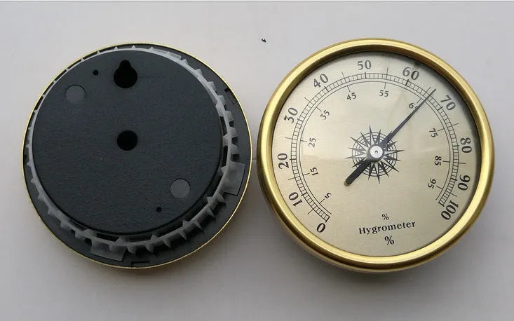 Analogue thermometer and hygrometer with aluminium dial showing humidity and temperature readings