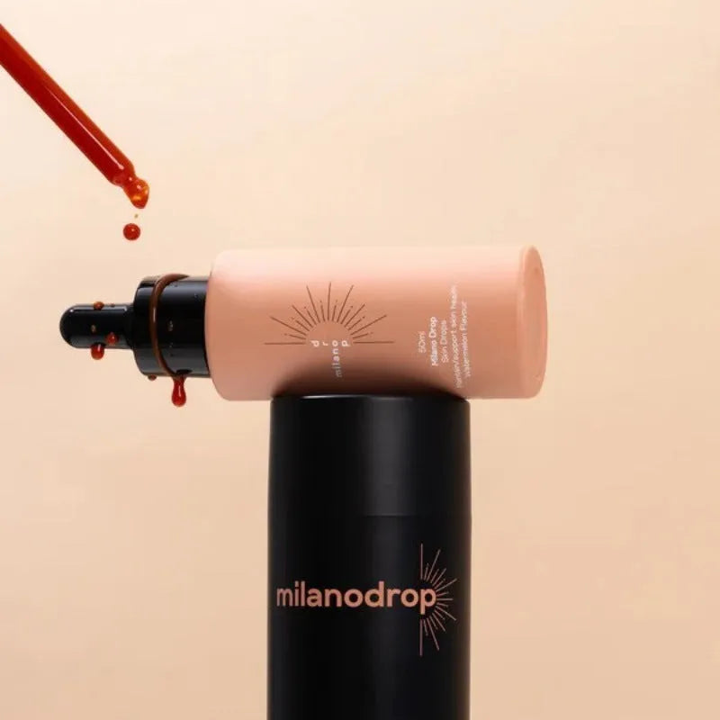 Matte black self-tanning liquid kit showing 50ml tanning drops bottle and 75ml tanning flash cream tube.