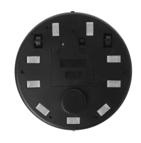 Silver-coloured compact automatic sweeping robot vacuum cleaner on a wooden floor.