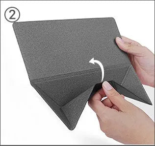 Blue foldable laptop cooling bracket with anti-slip surface shown open next to a closed laptop