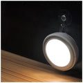 Circular white motion sensor LED light unit showing 80mm diameter on a table.