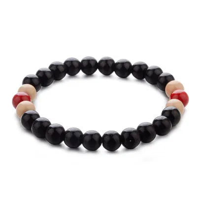 Natural lava stone bead bracelet for men and women on a wrist, showing ethnic style and essential oil application.