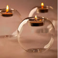 Clear round hollow handmade glass candle holder in European style on a table