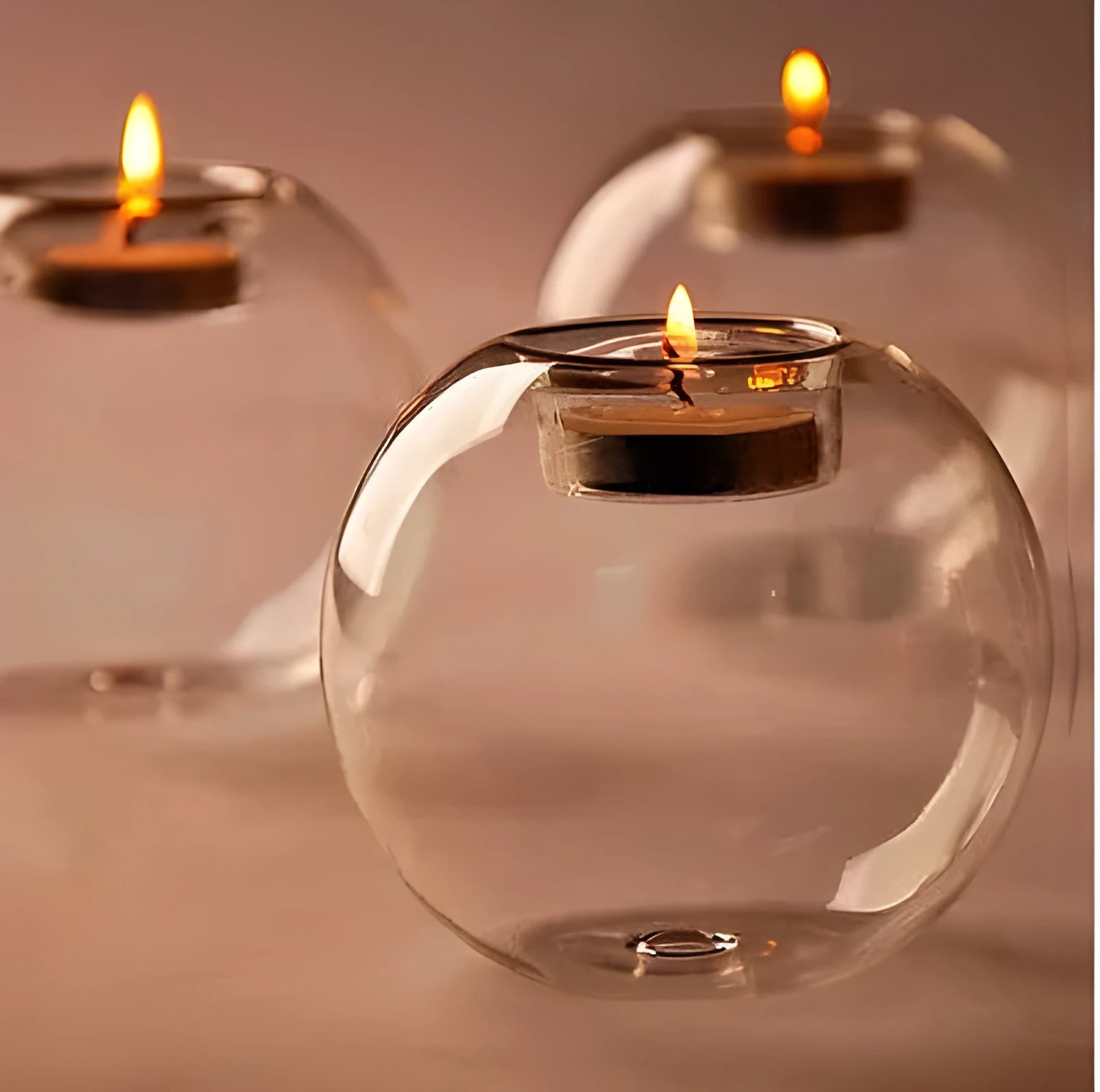 Clear round hollow handmade glass candle holder in European style on a table