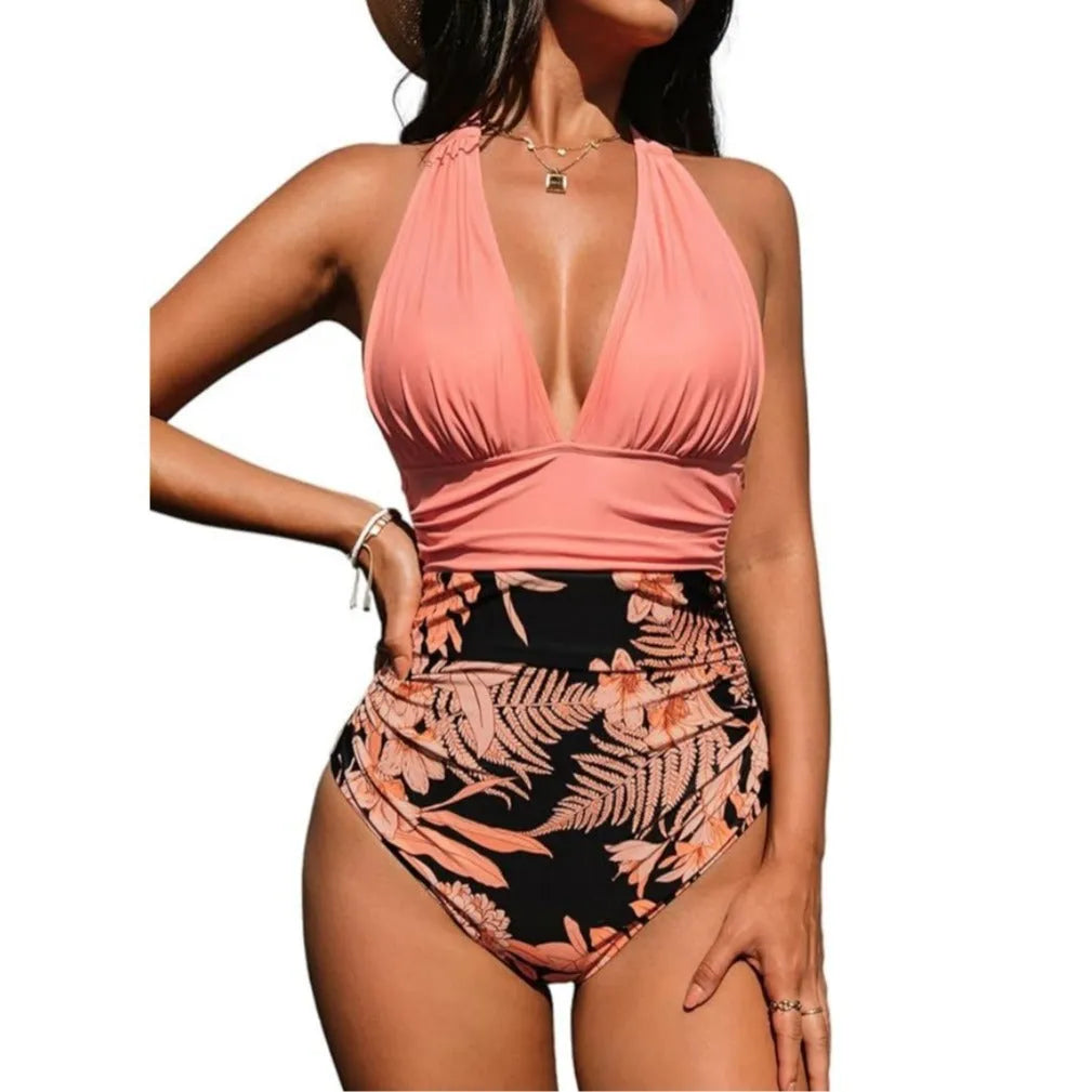 Women's one-piece halter swimsuit in pink floral and leopard print patterns featuring a backless design for swimming.