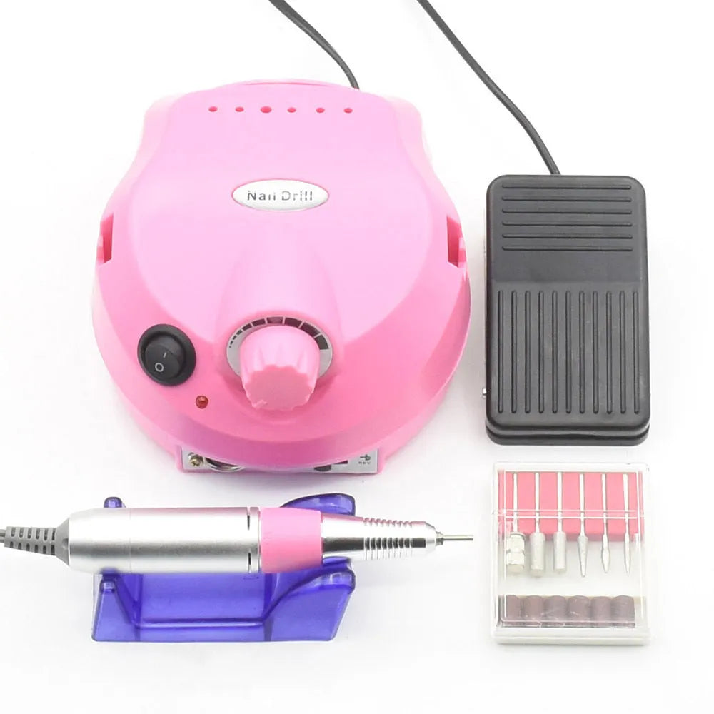 Nail 202 sander in pink with handpiece, foot switch, and grinding heads on a white background