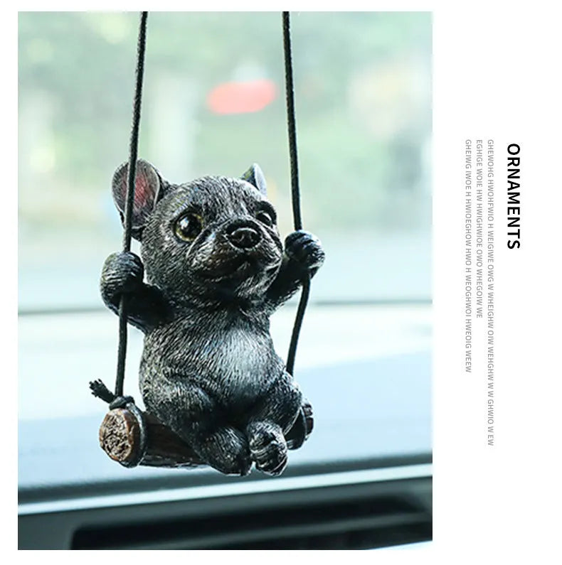 Cartoon-style resin bulldog car pendant hanging from a rearview mirror.