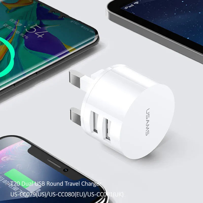 White portable USB phone charger with built-in US EU UK adapter plugs showing compact dimensions
