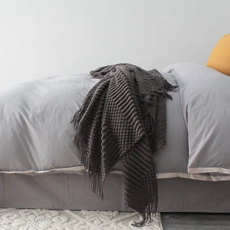 Small light grey polyester nap blanket laid flat showing 127x170cm size.