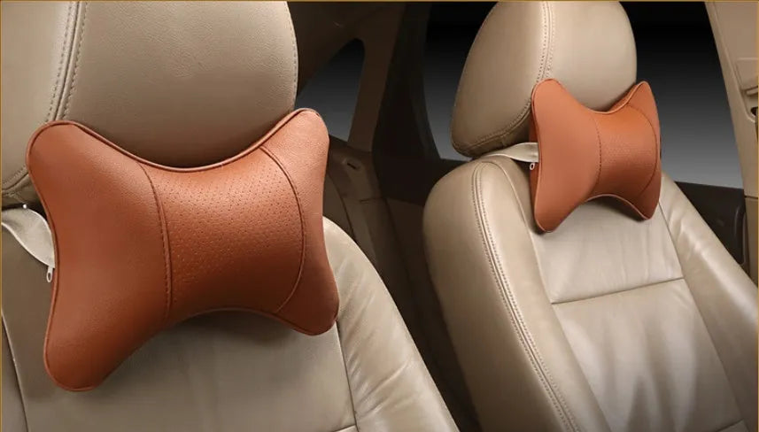 Breathable car headrest with leather cover, down yarn filling, and classic punched ventilation pattern