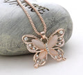 Butterfly Spirit Necklace in gold with alloy butterfly pendant, diamond treatment and snake bone chain with hanging fall